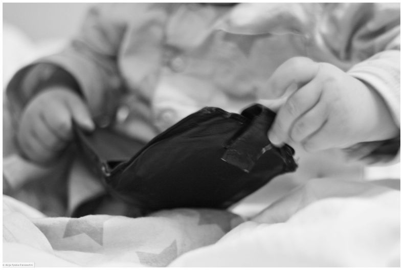 Baby playing with a wallet 2