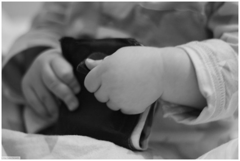 Baby playing with a wallet